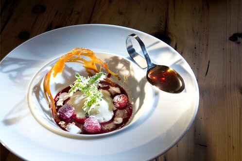 Raspberry sorbet with a spruce honey sauce