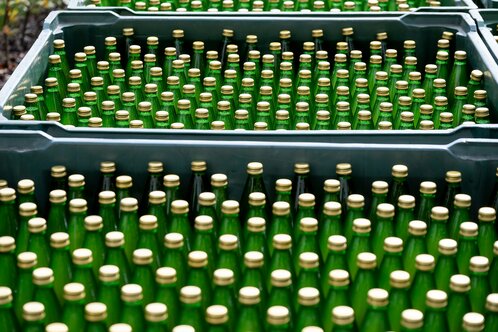 Freshly filled apple juice bottles